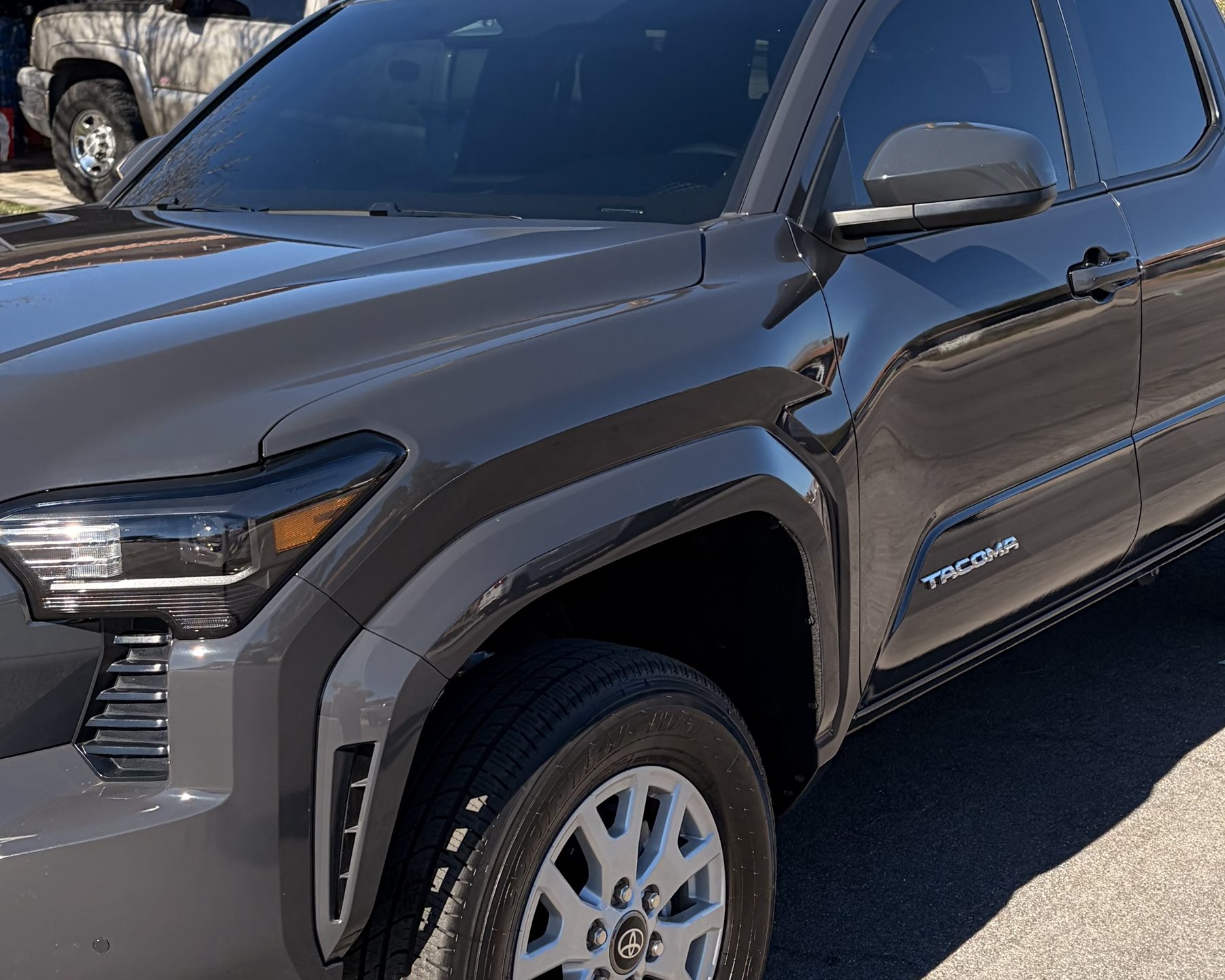 Finished vehicle with professionally installed dark window tint inside the Tint Broz shop